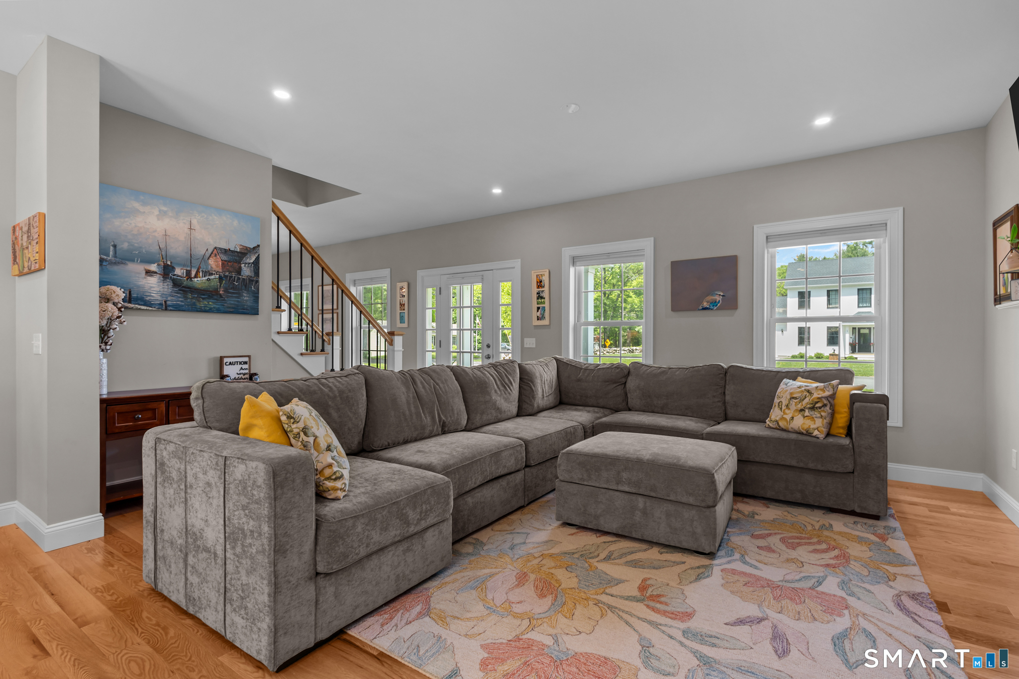 2 Martys Way Gales Ferry, CT 06335 - Photo 2 of 40 a living room with furniture and a view of kitchen