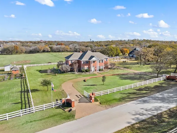 an aerial view of a house with a ocean view