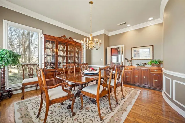 a view of a livingroom with workspace and a window