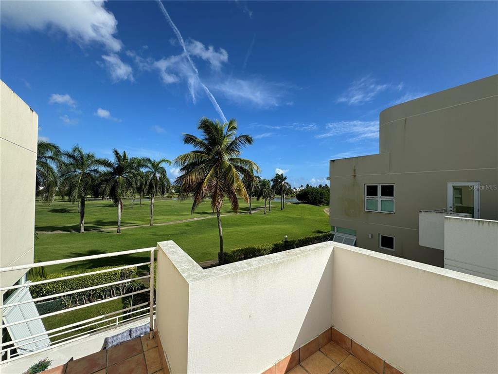Villas De Golf East Villas De Golf East Dorado Del Mar Boulevard, Unit 91 Dorado, PR 00646 - Photo 14 of 15 a view of a back yard