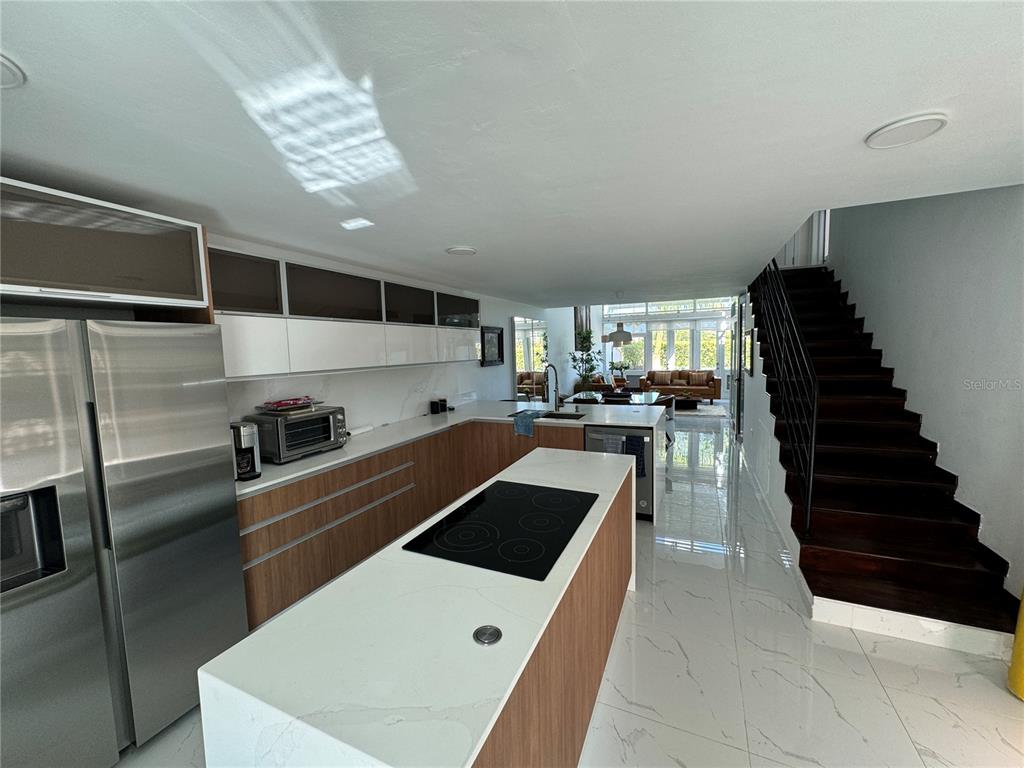 Villas De Golf East Villas De Golf East Dorado Del Mar Boulevard, Unit 91 Dorado, PR 00646 - Photo 3 of 15 a kitchen with a refrigerator and a sink