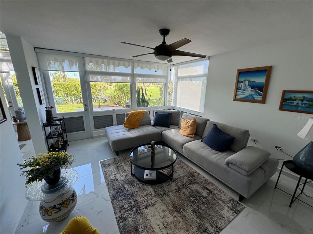 Villas De Golf East Villas De Golf East Dorado Del Mar Boulevard, Unit 91 Dorado, PR 00646 - Photo 5 of 15 a living room with furniture and a large window