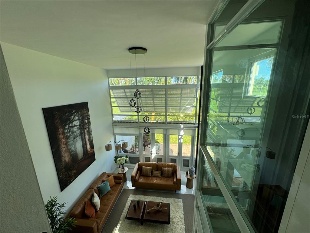 Villas De Golf East Villas De Golf East Dorado Del Mar Boulevard, Unit 91 Dorado, PR 00646 - Photo 7 of 15 a room with furniture and a flat screen tv