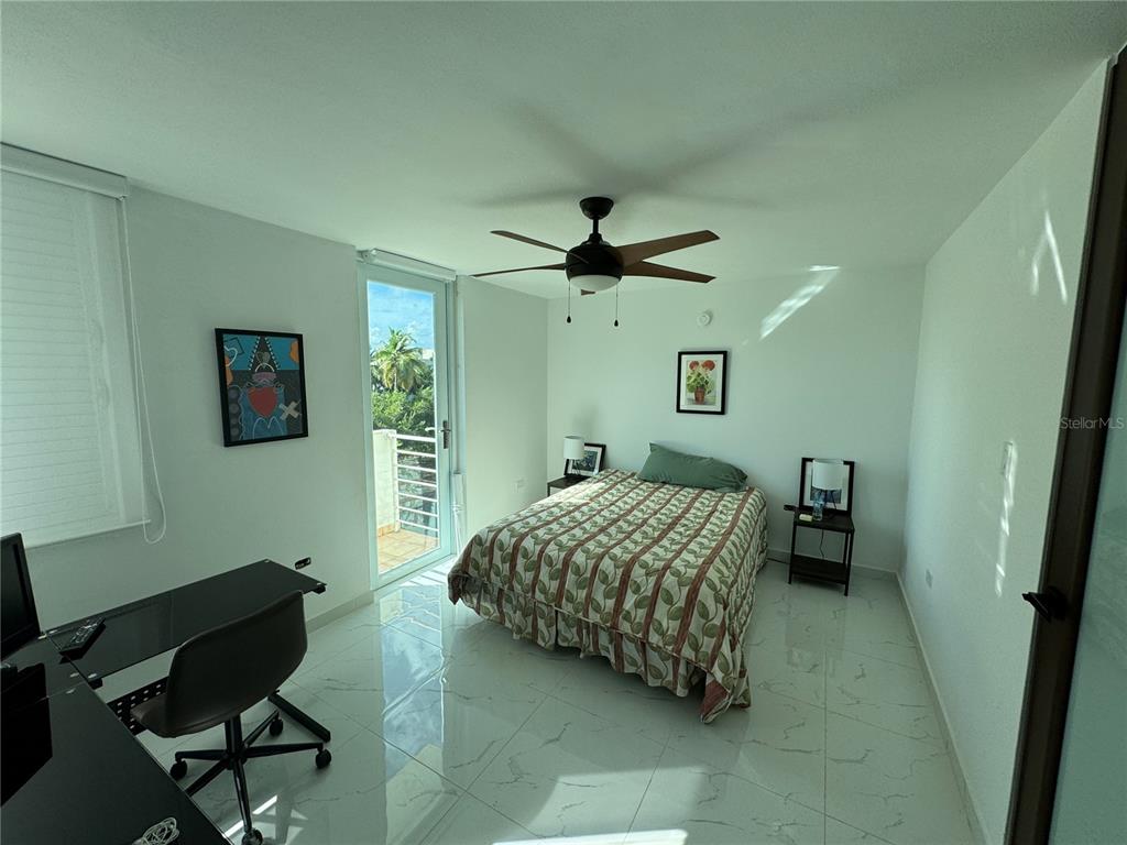 Villas De Golf East Villas De Golf East Dorado Del Mar Boulevard, Unit 91 Dorado, PR 00646 - Photo 8 of 15 a bedroom with a bed and a chair