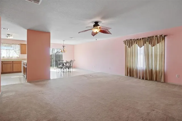 a view of a livingroom with furniture and a window