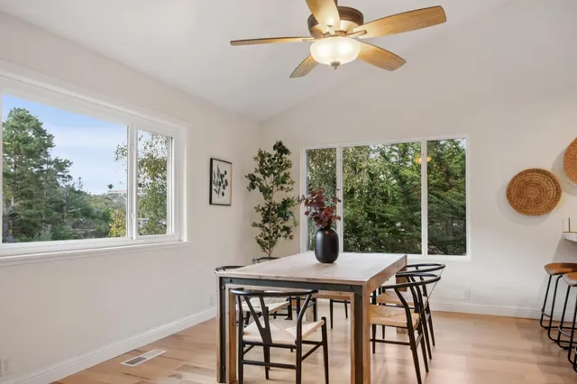 a view of a dining room with furniture window and outside view