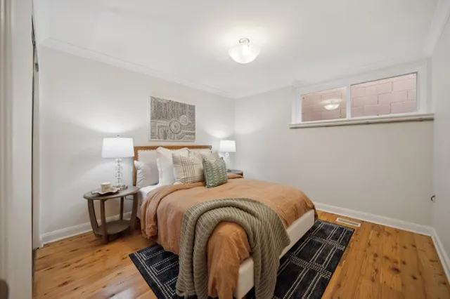 a bedroom with a bed and a night stand