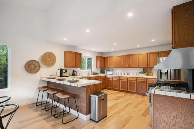a kitchen with a table and chairs in it