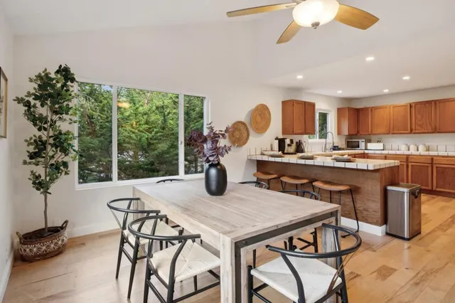 a kitchen with a table and chairs in it