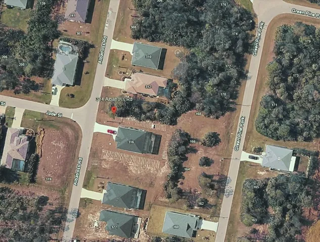 an aerial view of a house with outdoor space
