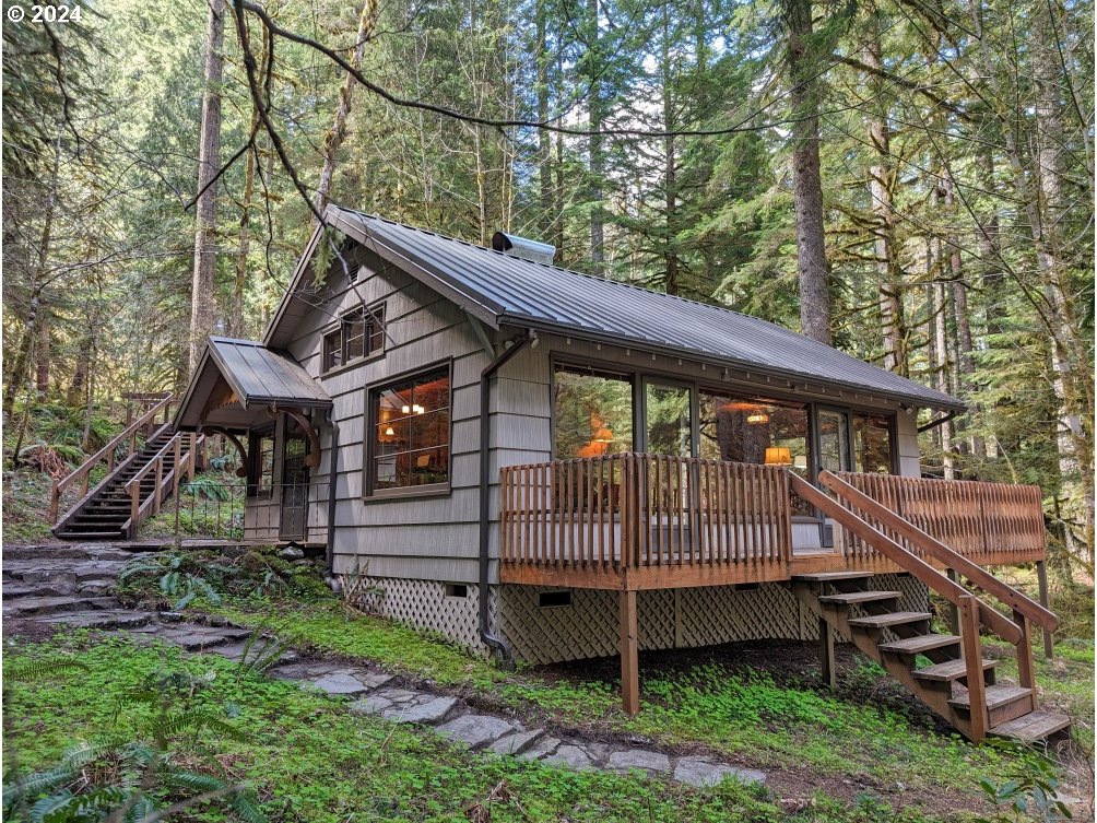 28580 Still Creek Road Rhododendron, OR 97049 - Photo 1 of 40 a view of a house with a yard