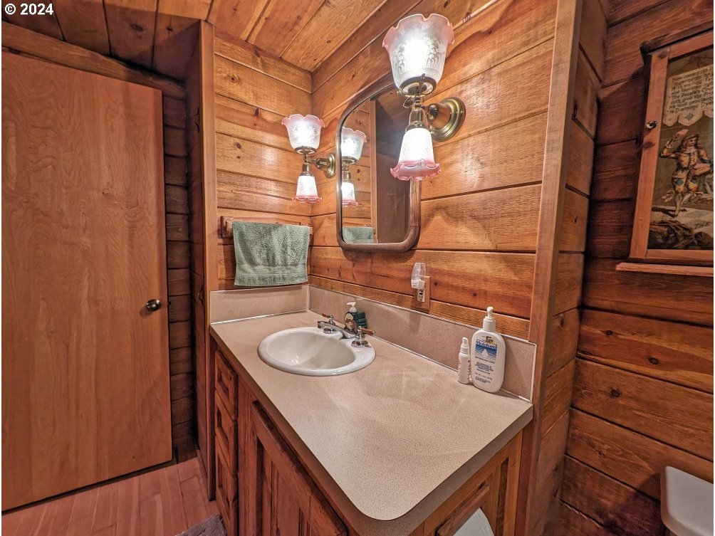 28580 Still Creek Road Rhododendron, OR 97049 - Photo 22 of 40 a bathroom with a sink a vanity and a mirror
