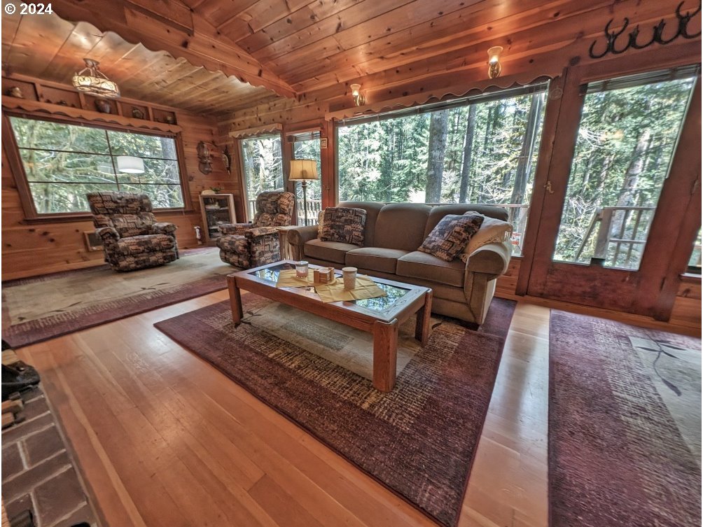 28580 Still Creek Road Rhododendron, OR 97049 - Photo 8 of 40 a living room with furniture a large window