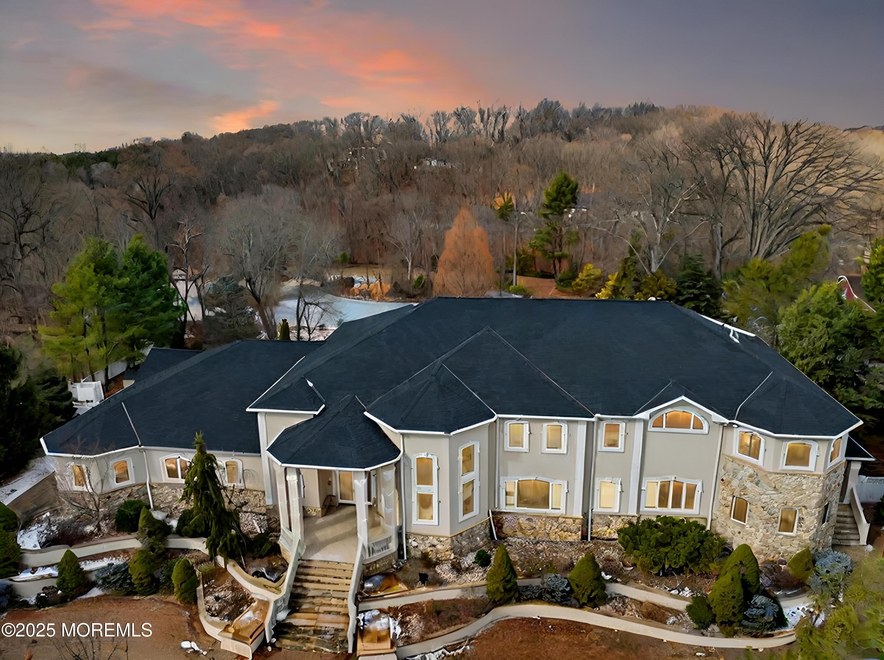 a view of a patio with table and chairs under an umbrella