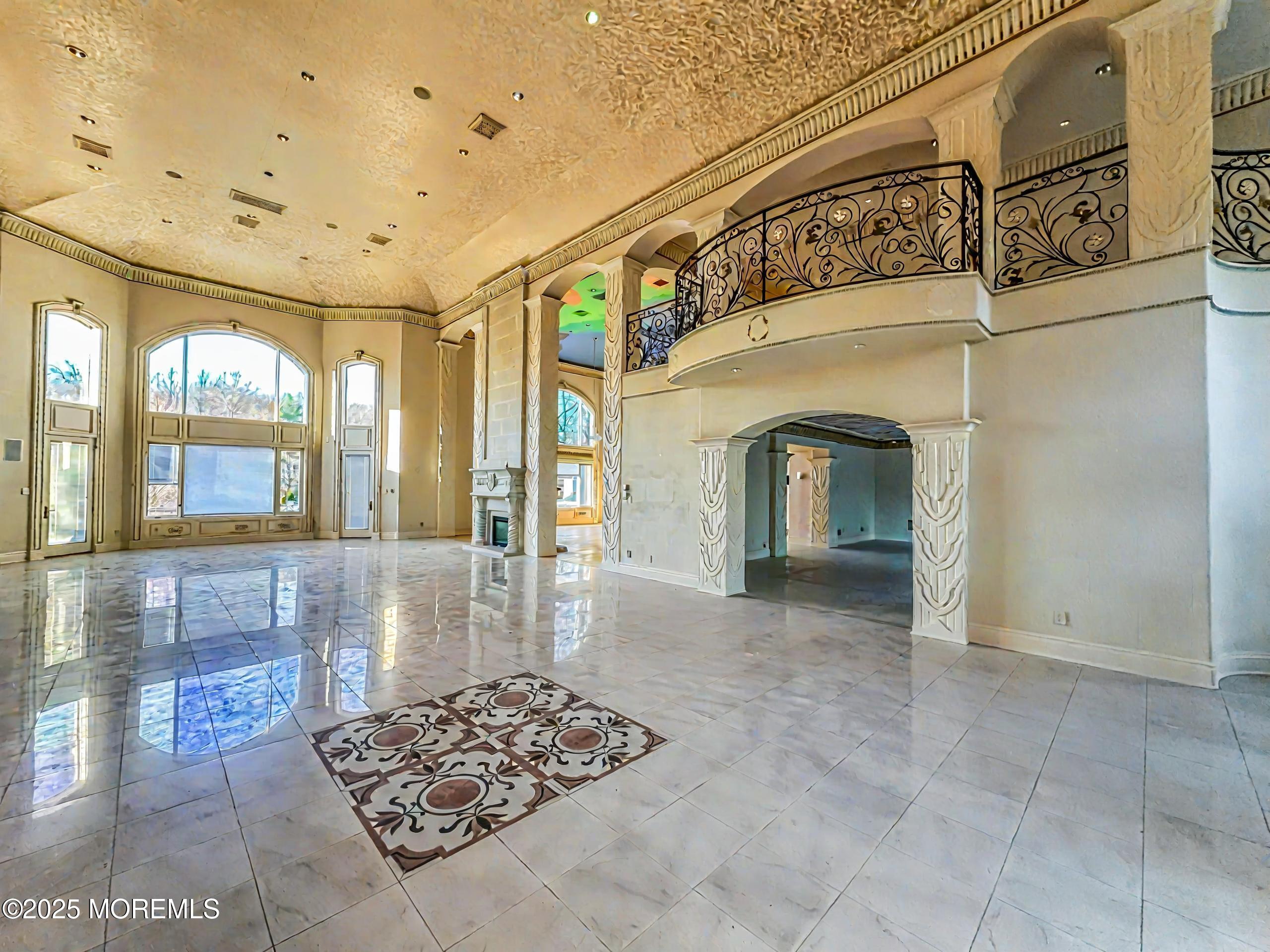 105 Middletown Road Holmdel, NJ 07733 - Photo 16 of 54 a view of a hallway with wooden floor and a chandelier