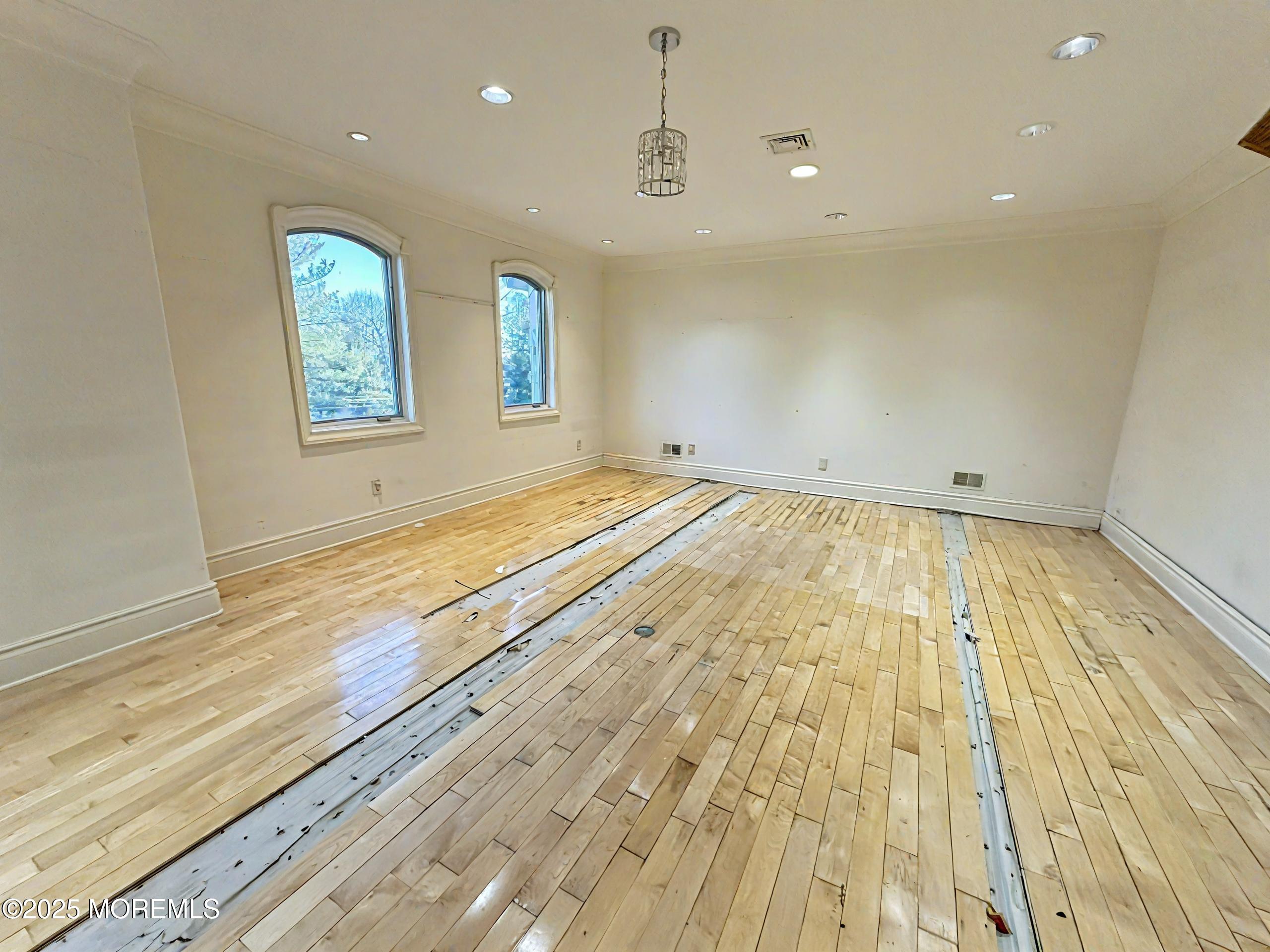 105 Middletown Road Holmdel, NJ 07733 - Photo 19 of 54 a view of empty room with wooden floor and fan