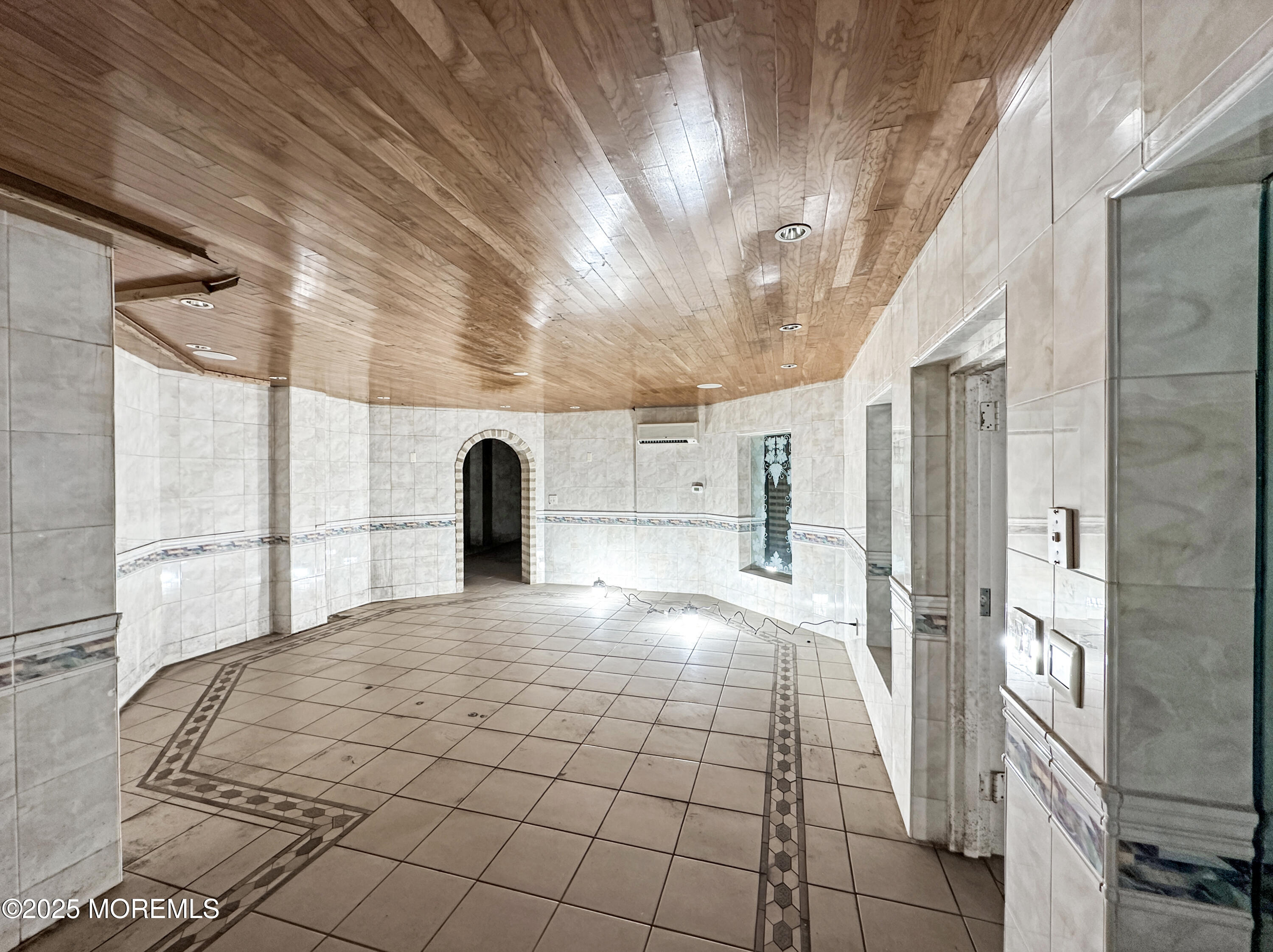 105 Middletown Road Holmdel, NJ 07733 - Photo 24 of 54 a large white bed in a white room