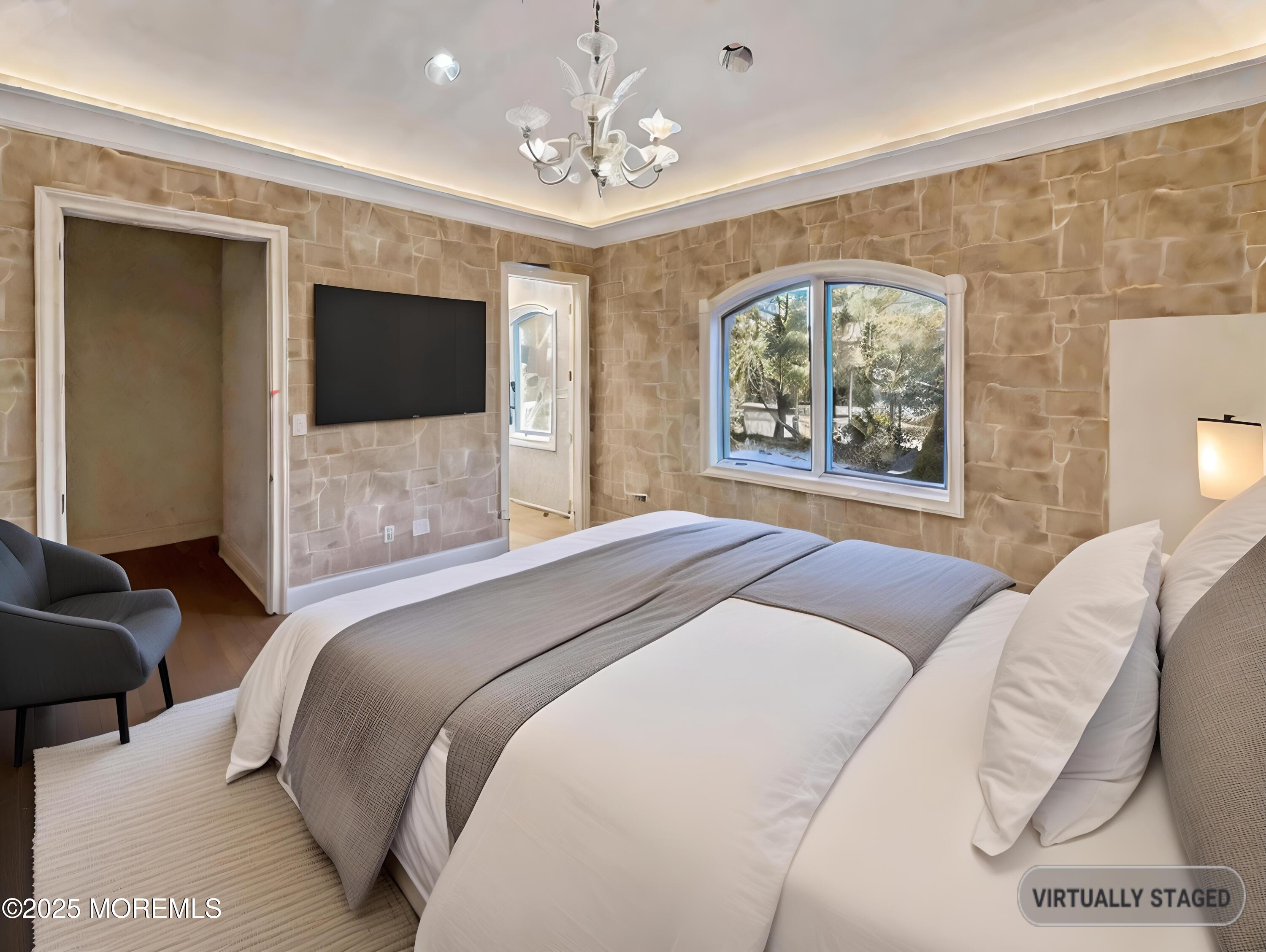 105 Middletown Road Holmdel, NJ 07733 - Photo 50 of 54 a bedroom with a large bed and a flat screen tv