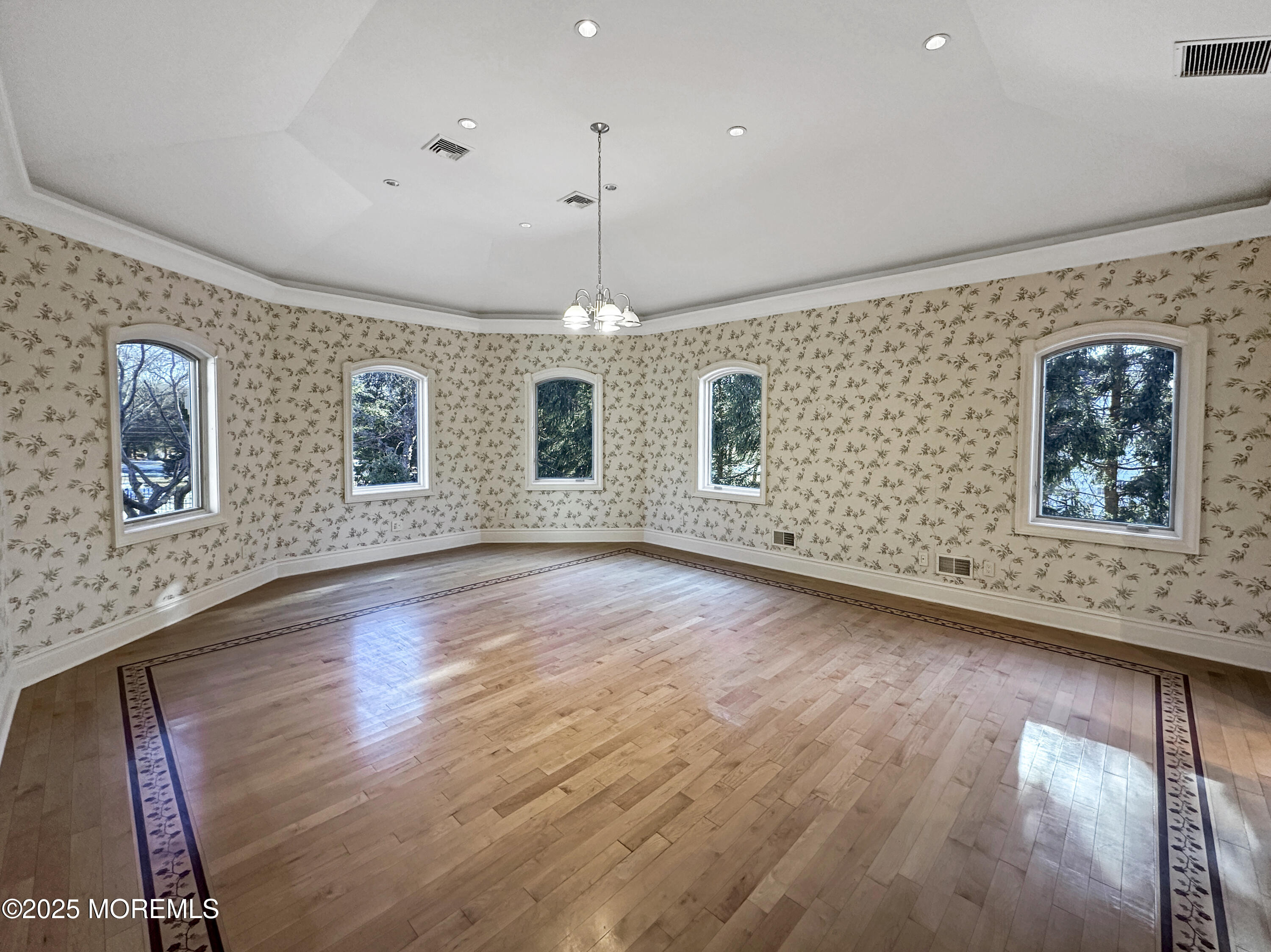 105 Middletown Road Holmdel, NJ 07733 - Photo 51 of 54 a view of an empty room with window and wooden floor