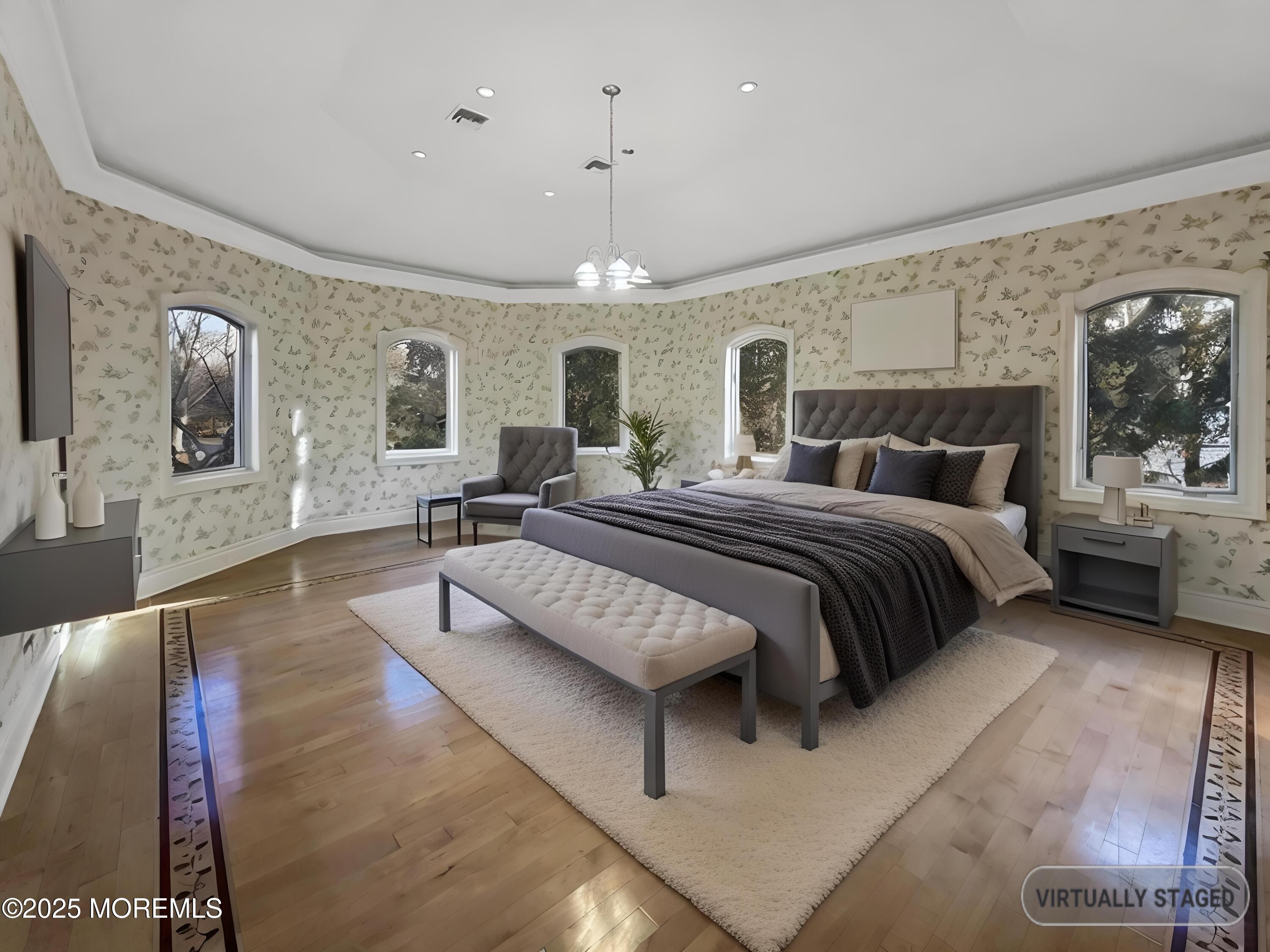 105 Middletown Road Holmdel, NJ 07733 - Photo 52 of 54 a bedroom with a large bed a flat tv screen and a dresser