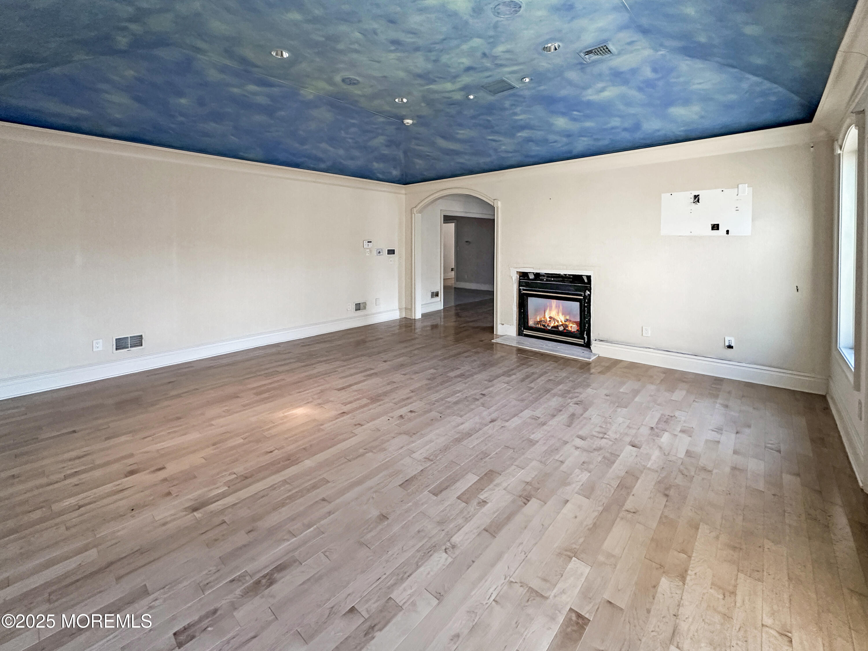105 Middletown Road Holmdel, NJ 07733 - Photo 53 of 54 a view of an empty room with wooden floor