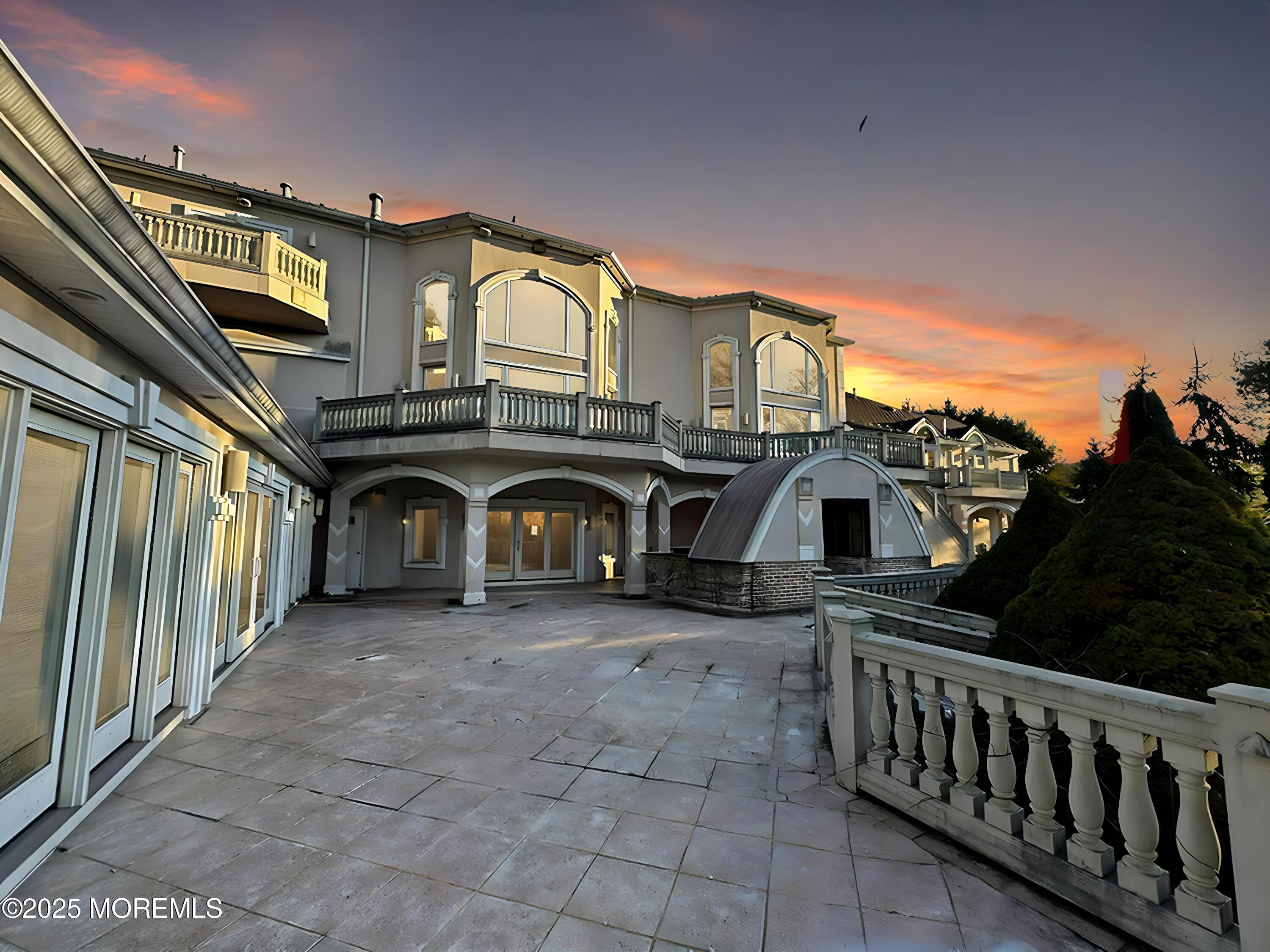 105 Middletown Road Holmdel, NJ 07733 - Photo 7 of 54 a view of a big house with a balcony