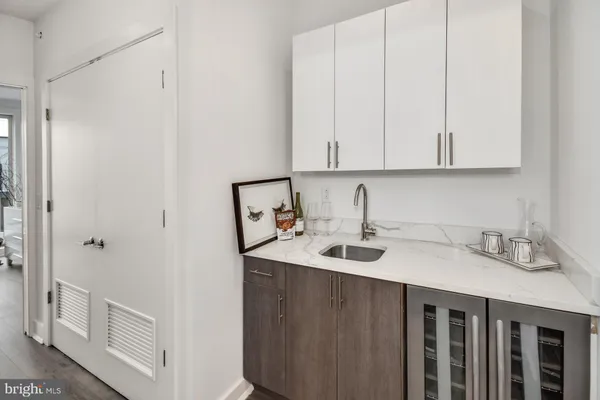 a kitchen with a sink and cabinets