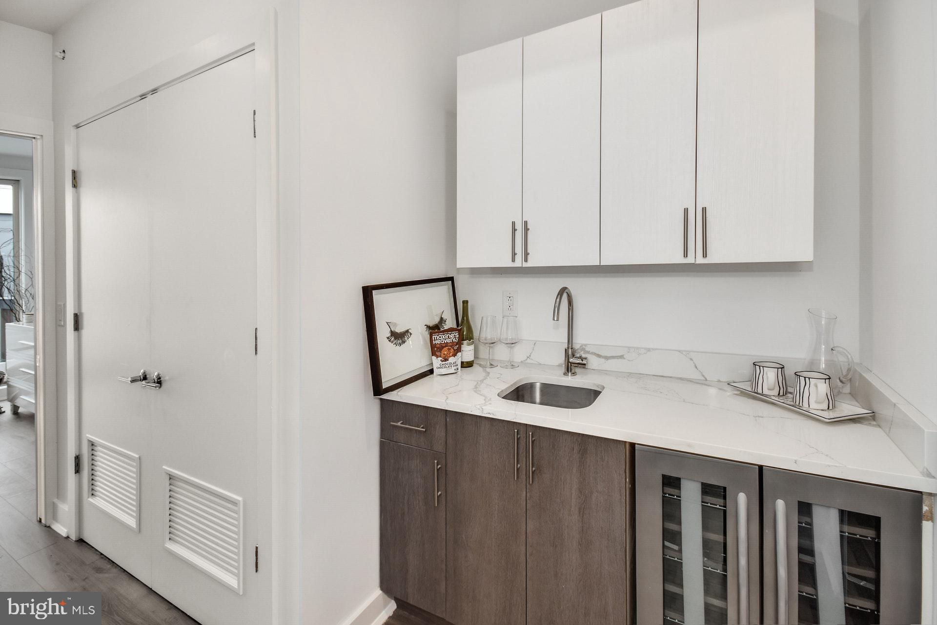 113 Olive Street Philadelphia, PA 19123 - Photo 18 of 33 a kitchen with a sink and cabinets