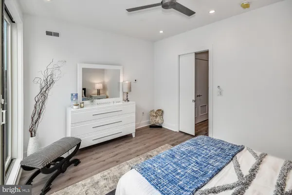 a room with a bed and furniture