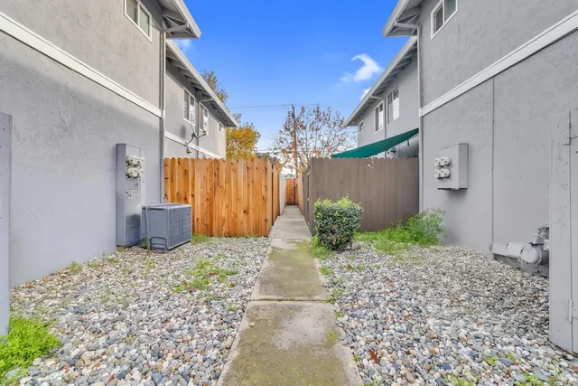 a front view of a house with a garden and garage