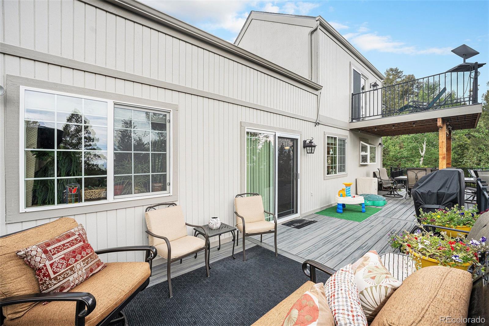 9780 South Warhawk Road Conifer, CO 80433 - Photo 11 of 44 a balcony with furniture and a potted plant