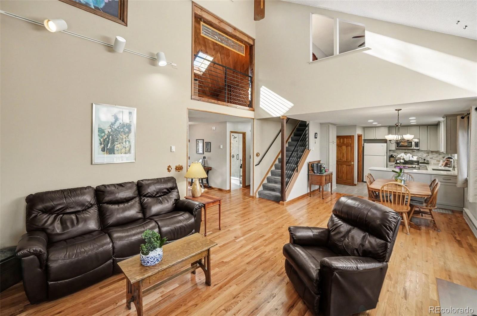 9780 South Warhawk Road Conifer, CO 80433 - Photo 12 of 44 a living room with furniture and a wooden floor