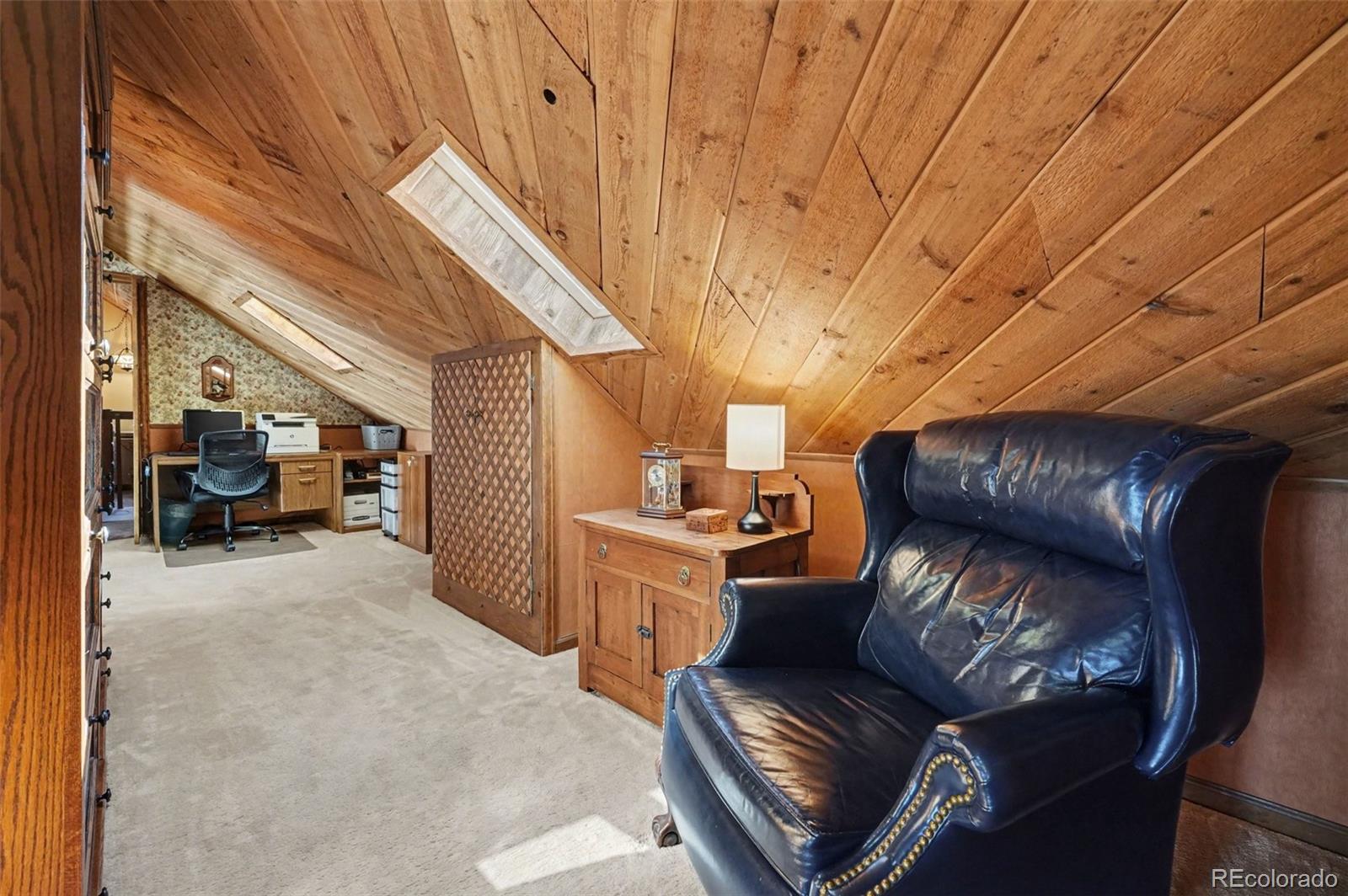 9780 South Warhawk Road Conifer, CO 80433 - Photo 23 of 44 a view of living room filled with furniture and a couch