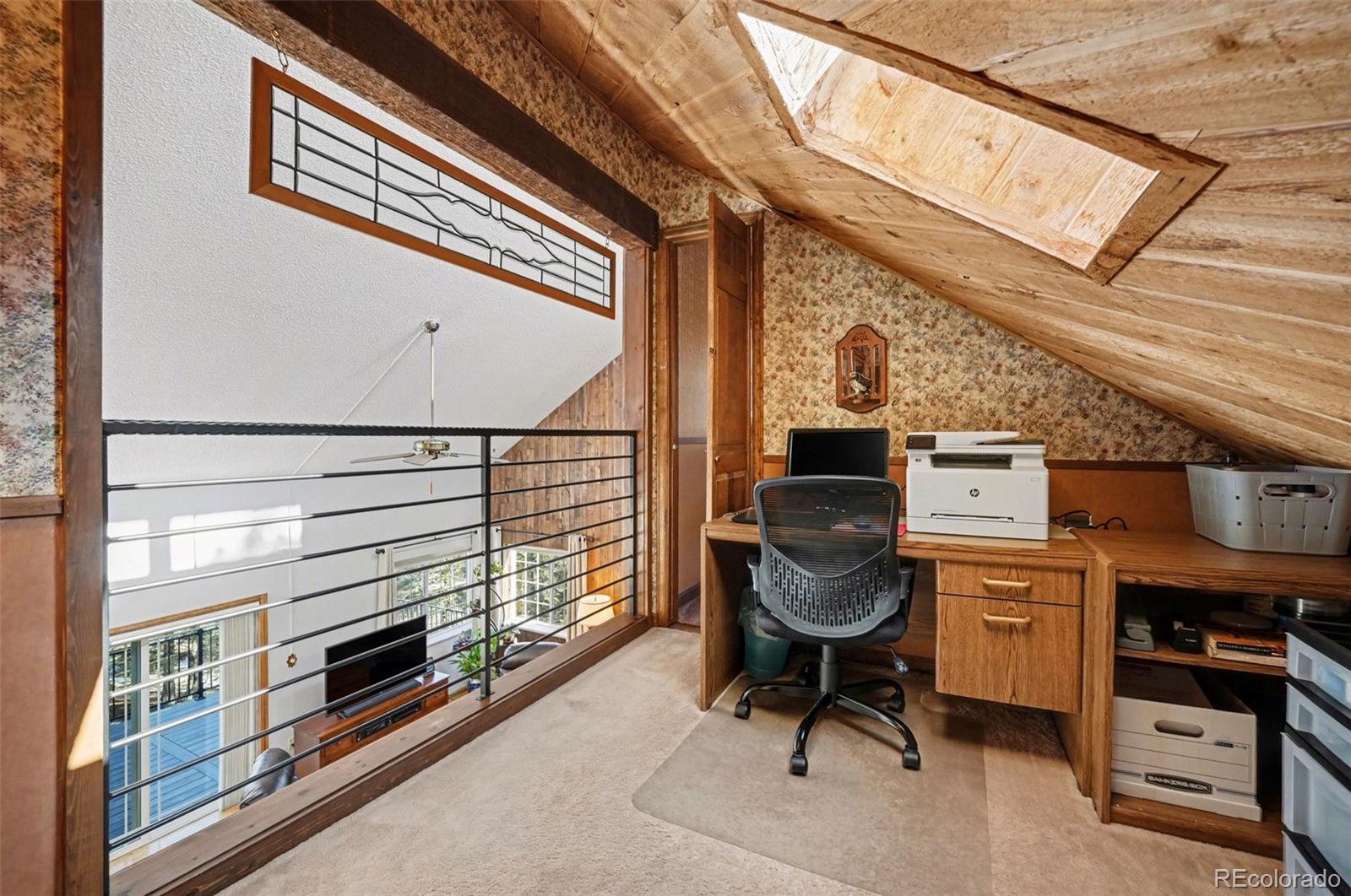 9780 South Warhawk Road Conifer, CO 80433 - Photo 24 of 44 a workspace with furniture