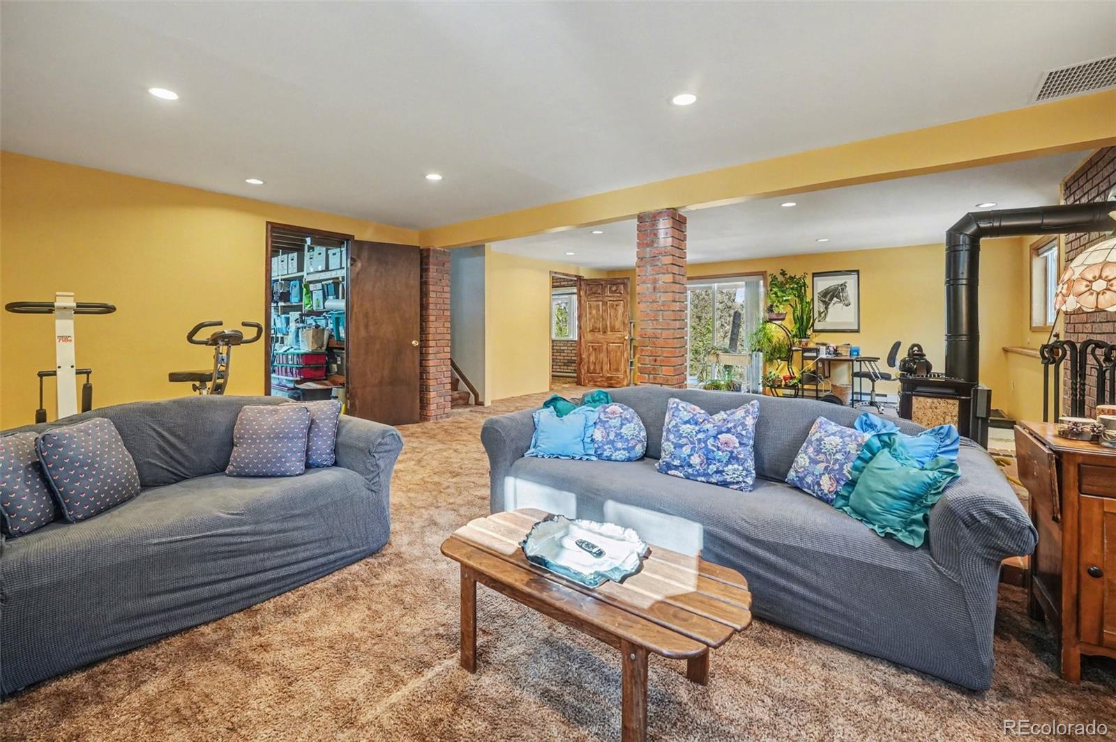 9780 South Warhawk Road Conifer, CO 80433 - Photo 27 of 44 a living room with furniture and a table