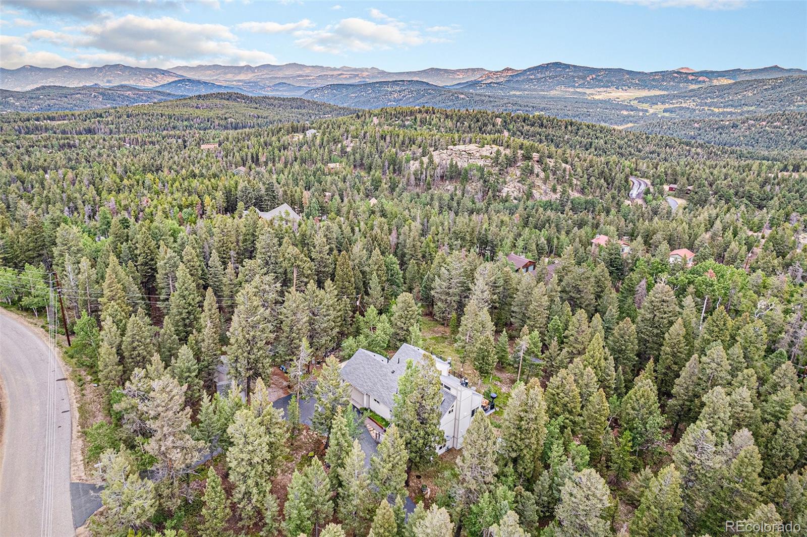 9780 South Warhawk Road Conifer, CO 80433 - Photo 38 of 44 a view of a city with mountain