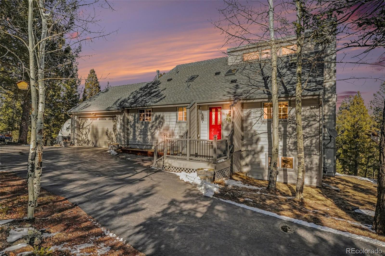 9780 South Warhawk Road Conifer, CO 80433 - Photo 44 of 44 a view of a house with a tree