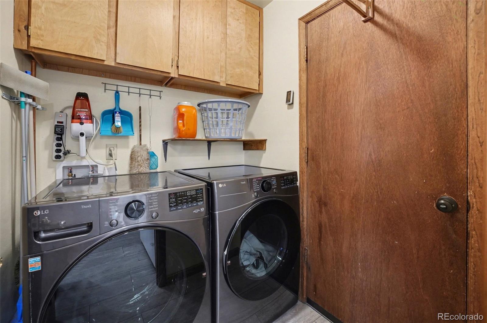 9780 South Warhawk Road Conifer, CO 80433 - Photo 6 of 44 a utility room with dryer and washer
