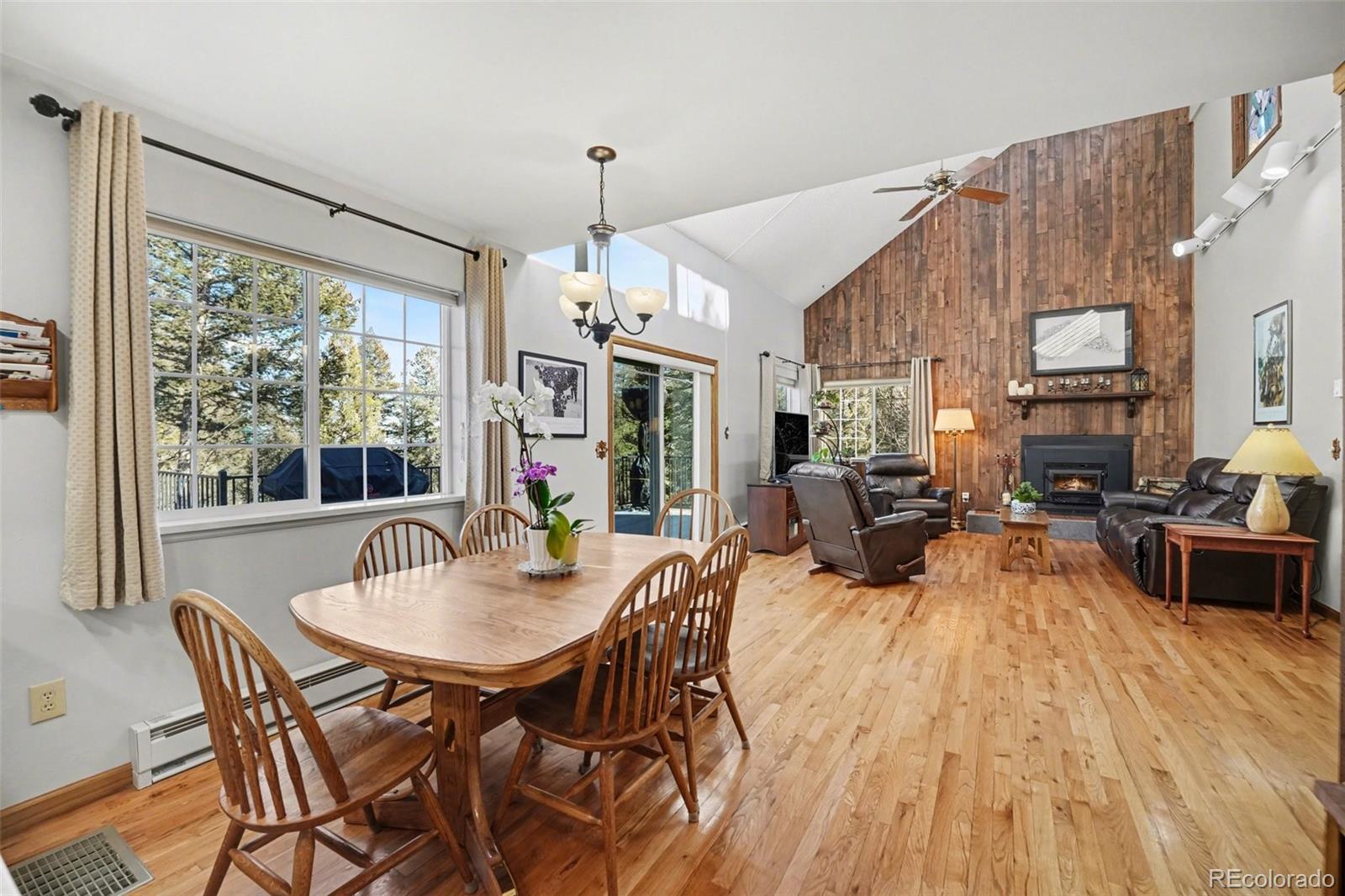 9780 South Warhawk Road Conifer, CO 80433 - Photo 7 of 44 a view of a dining room with furniture window and outside view