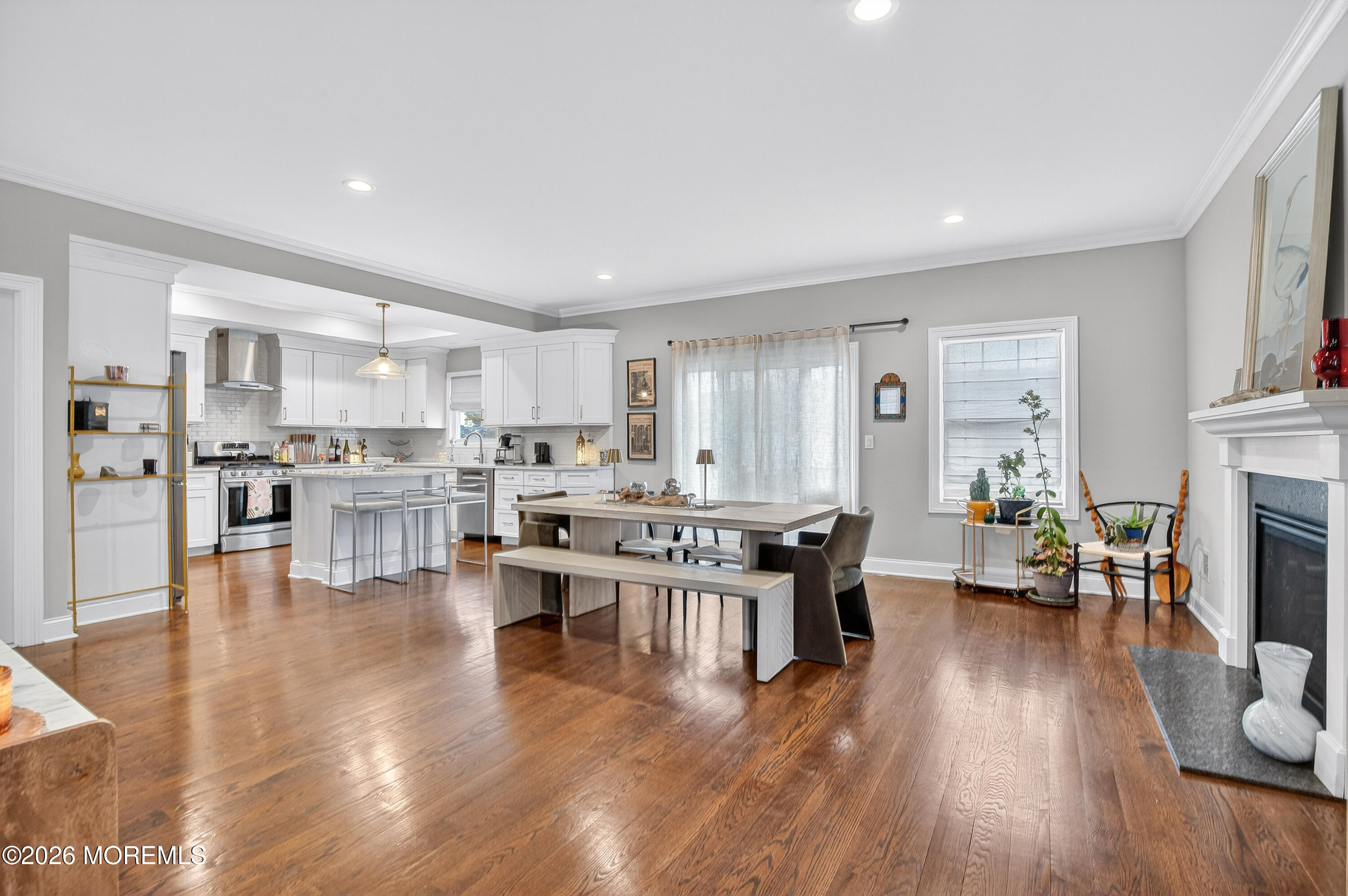 27 5th Street Highlands, NJ 07732 - Photo 3 of 62 a living room with stainless steel appliances furniture wooden floor and a kitchen view