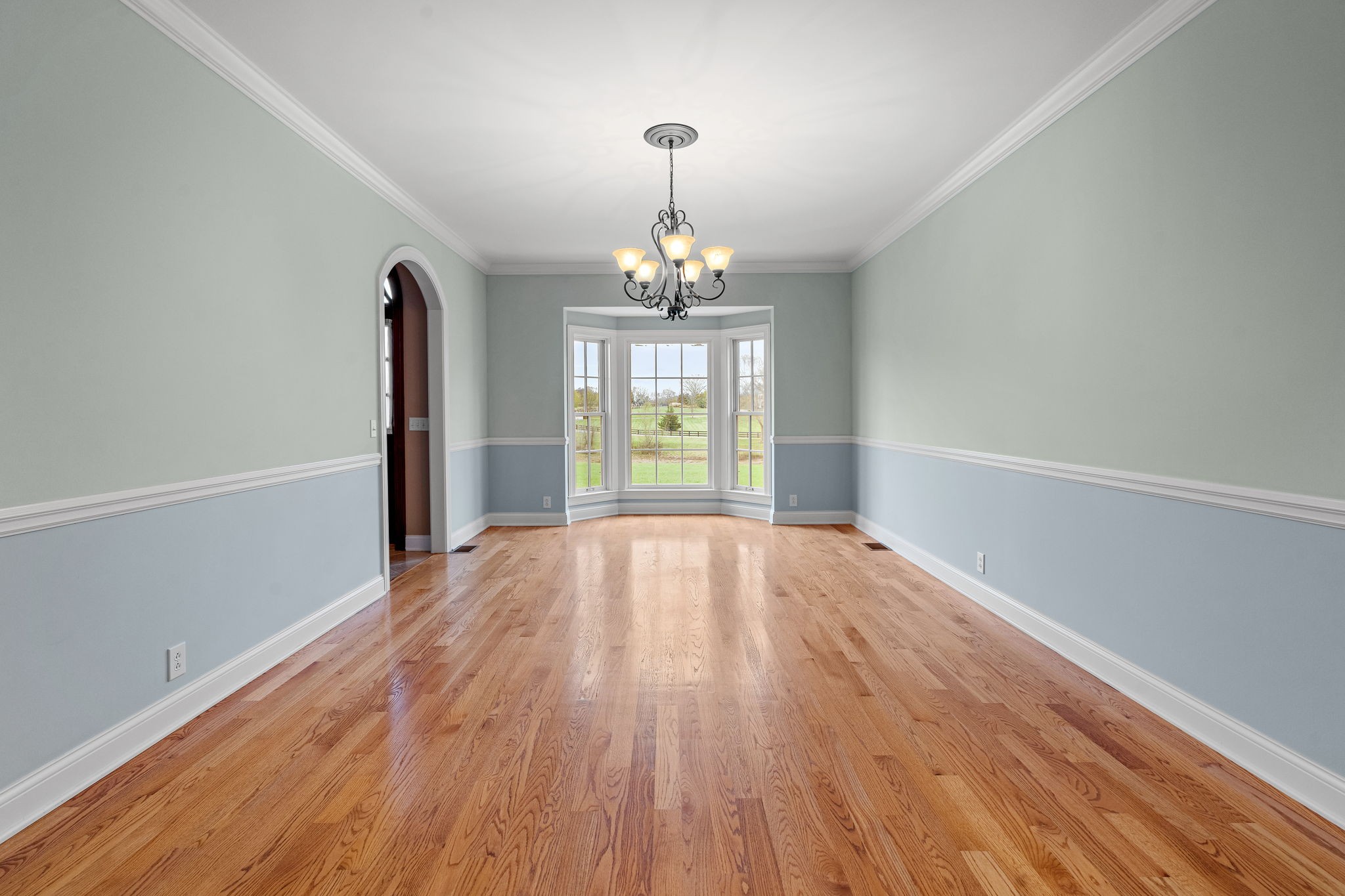 303 Middlefield Lane Lascassas, TN 37085 - Photo 11 of 49 a view of empty room with wooden floor and fan