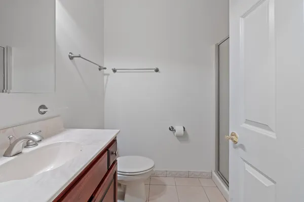 a bathroom with a sink toilet and vanity