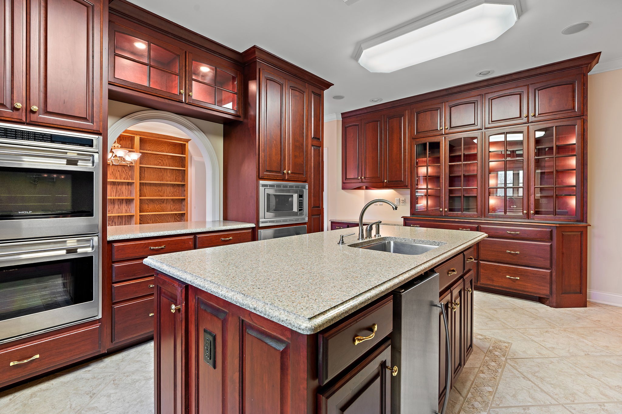 303 Middlefield Lane Lascassas, TN 37085 - Photo 17 of 49 a kitchen with a stove a sink and a refrigerator