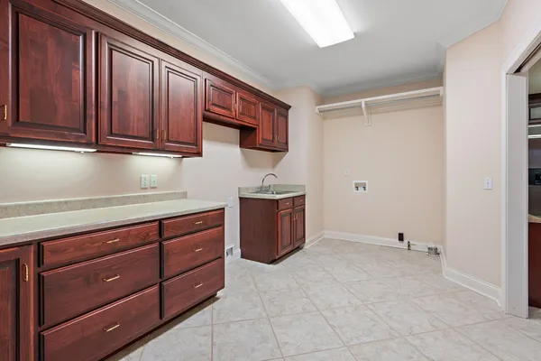 a kitchen with stainless steel appliances granite countertop a sink and cabinets