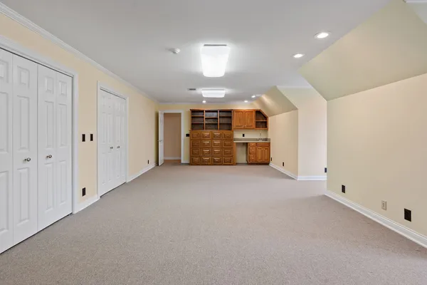 a view of an empty room with a fireplace