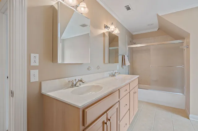 a bathroom with a sink a vanity a mirror and a bathtub