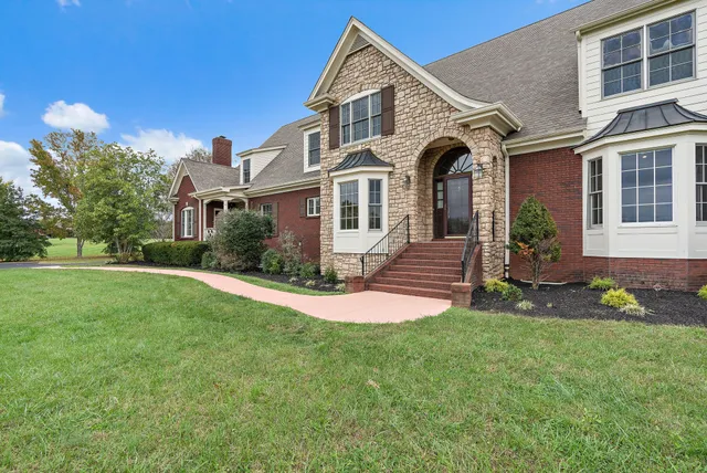 a front view of a house with garden