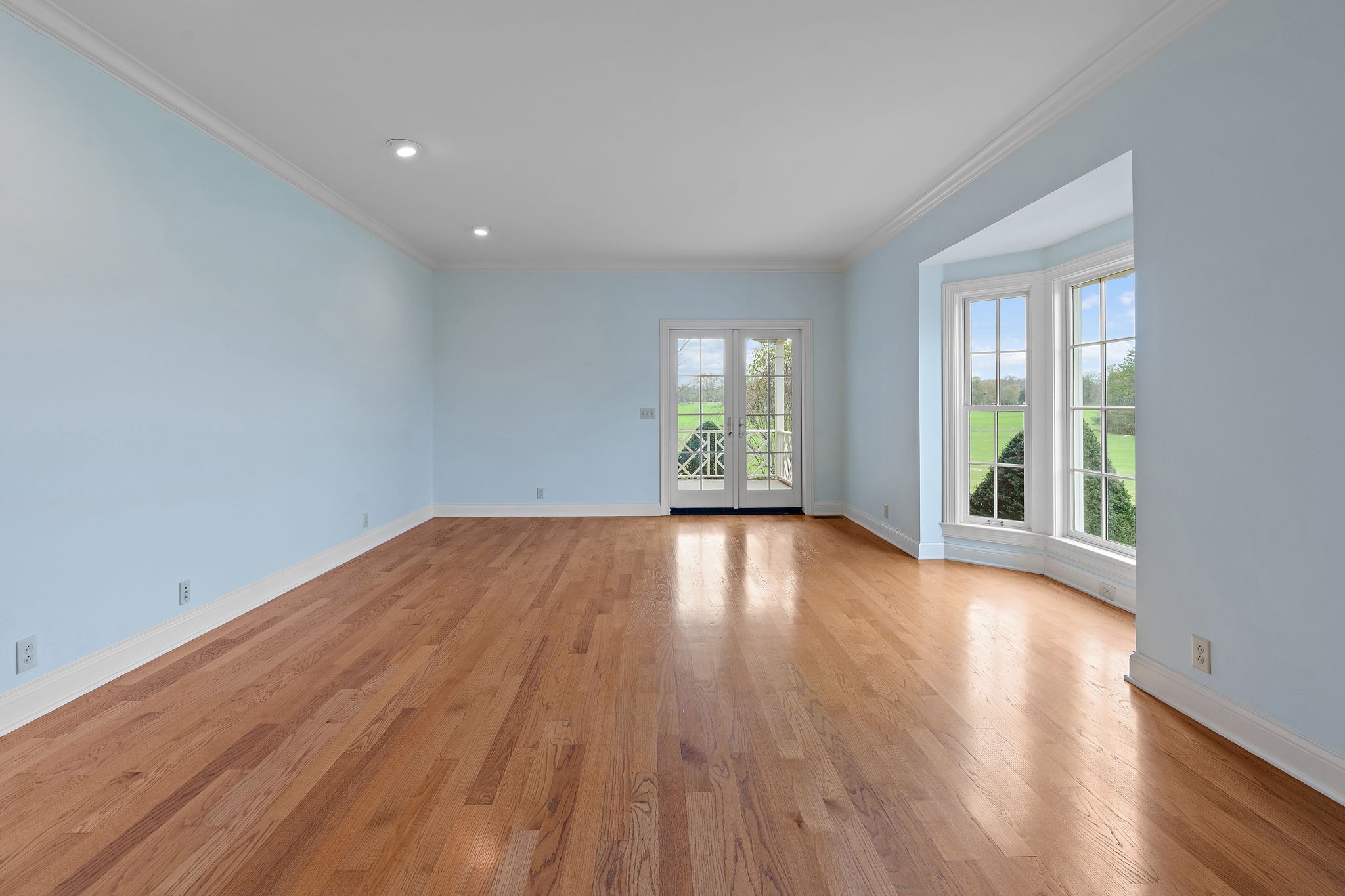 303 Middlefield Lane Lascassas, TN 37085 - Photo 6 of 49 a view of empty room with wooden floor and fan