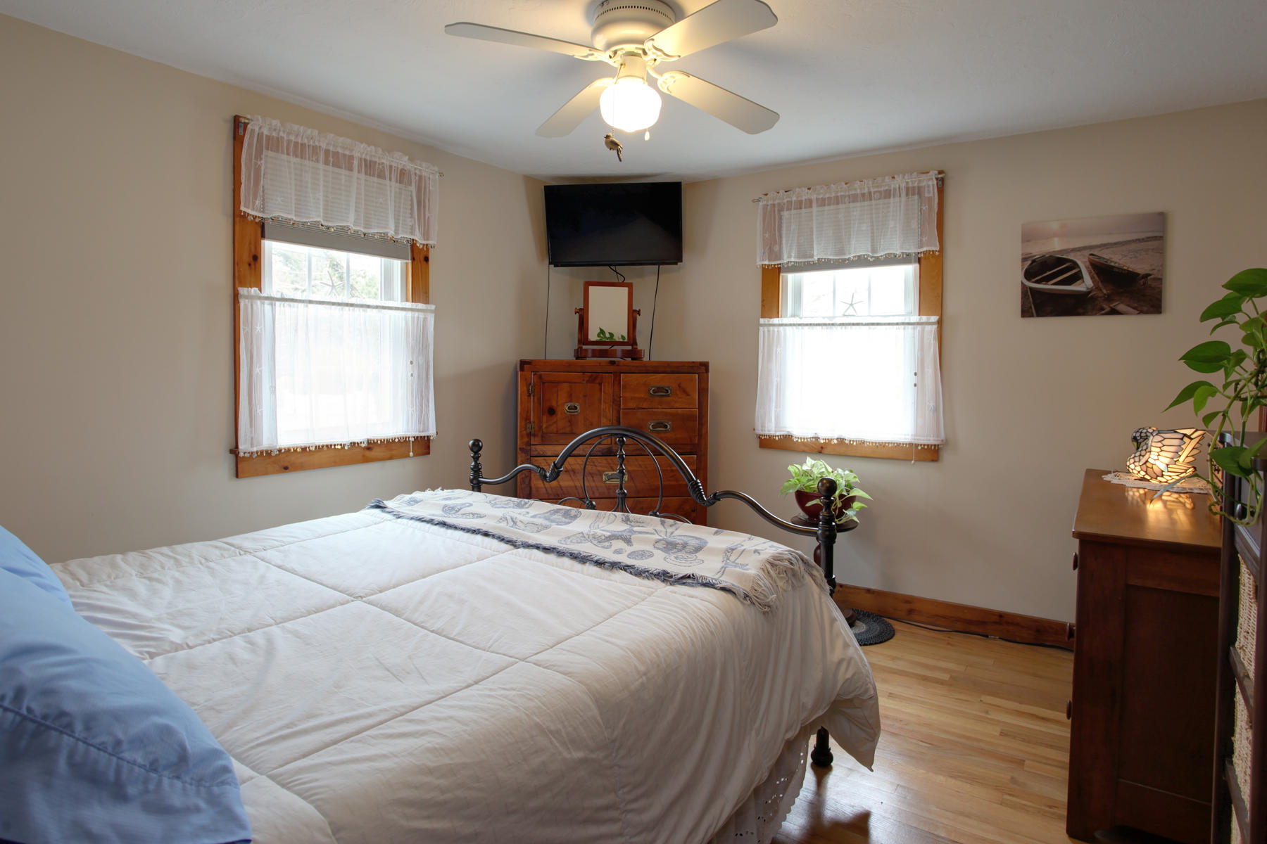 21 Naushon Road Dennis Port, MA 02639 - Photo 15 of 27 a bedroom with a bed and a window
