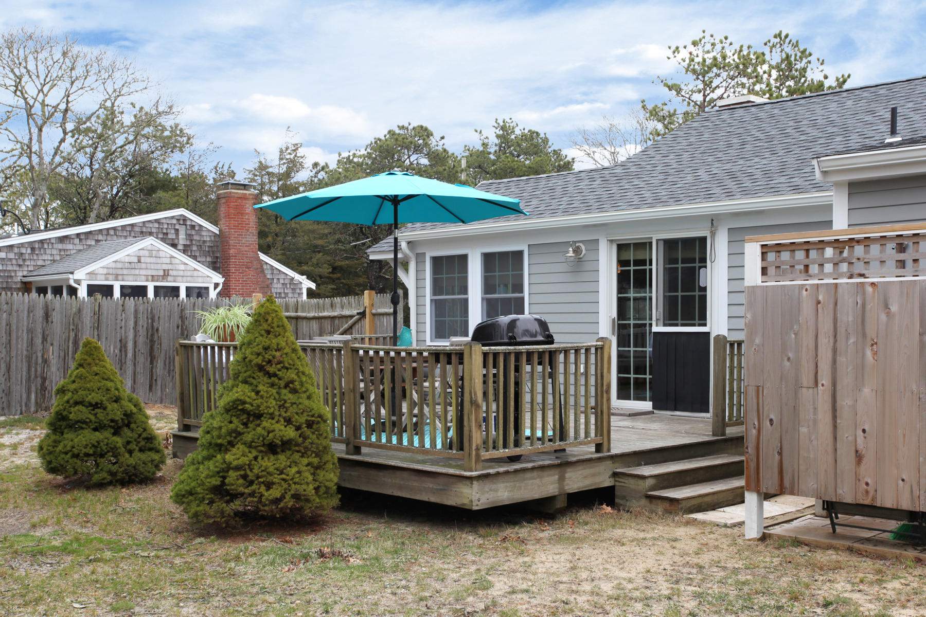 21 Naushon Road Dennis Port, MA 02639 - Photo 22 of 27 a view of a deck with a chairs and plants